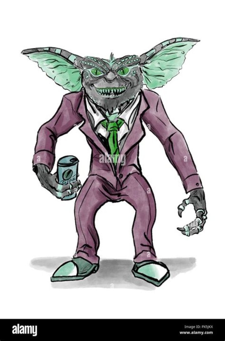 a gremlin in a suit drinking coffee Stock Photo Alamy