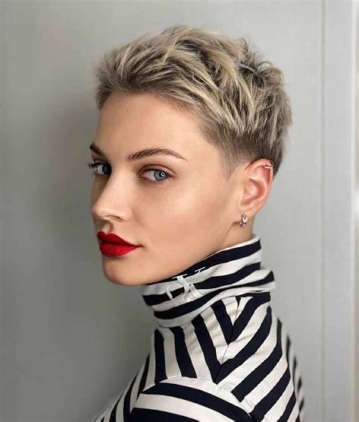 A messy, textured look with two braids across the forehead. There are