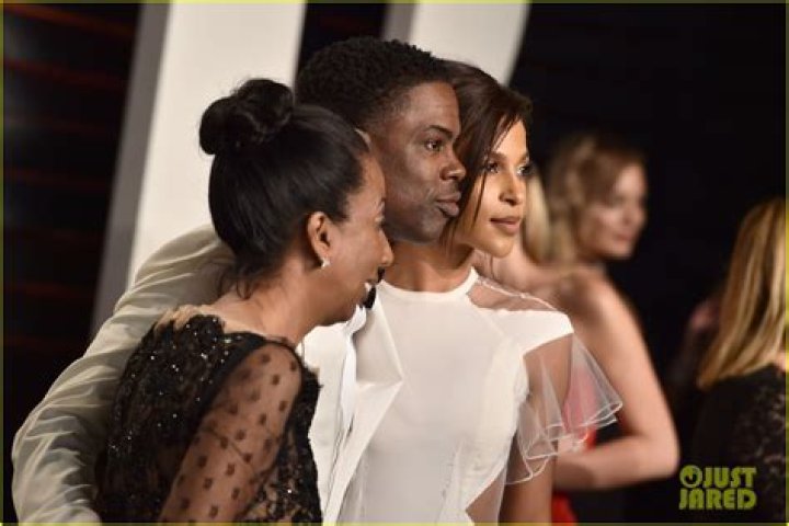 Chris Rock cuddles up to Megalyn Echikunwoke and mother Rosalie at