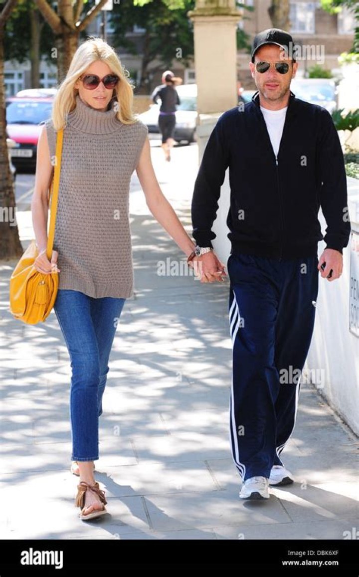 Claudia Schiffer and her husband Matthew Vaughn hold hands after