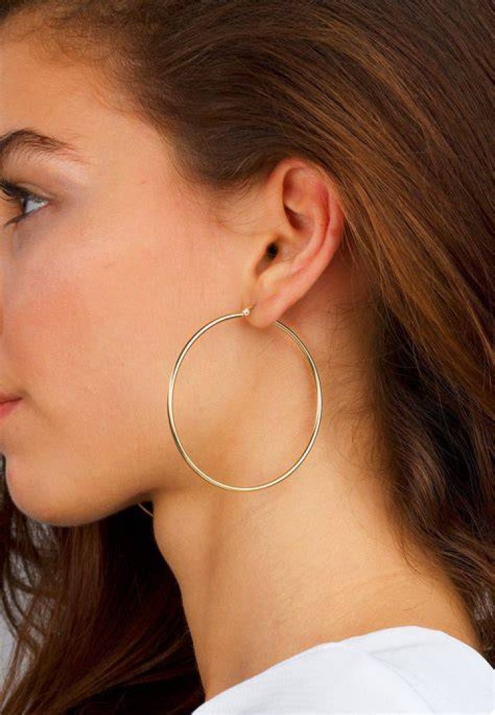 Claudia wearing big gold hoops Claudia Schiffer Photo (19839837