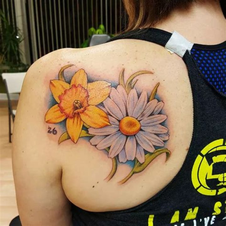 Colorful blowing daisy flower tattoo for you Body Tattoo Art