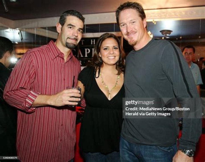 From left, Mike Lowell, Bertica Lowell, and Mike Timlin attend