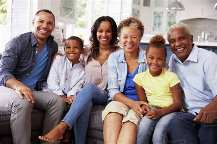Group portrait of multi generation black family at home Stock Photo