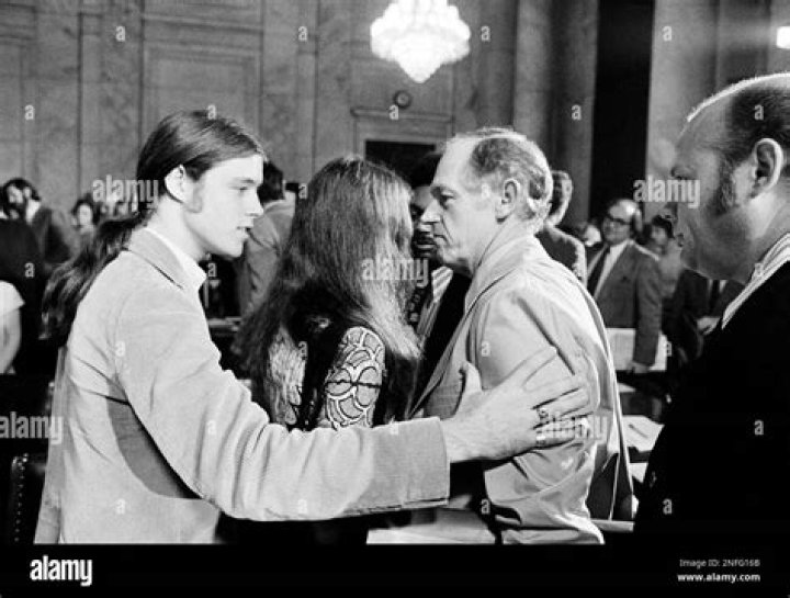 John Hunt, left puts his hand out to lead his father, E. Howard Hunt
