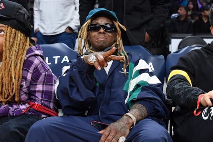 Lil Wayne Sits Courtside with Lookalike Son Kameron, 13, at NBA Finals