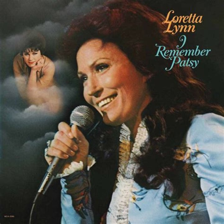 Loretta Lynn and one of her twin daughters with Alison Krause Loretta