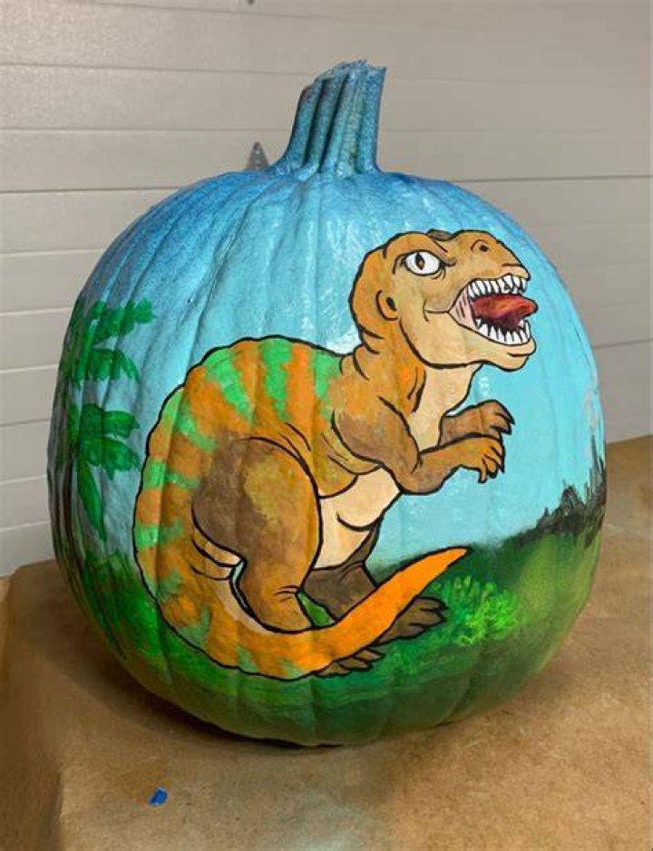 Painted Dinosaur Pumpkin with yellow adhesive foam dinosaurpumpkin 
