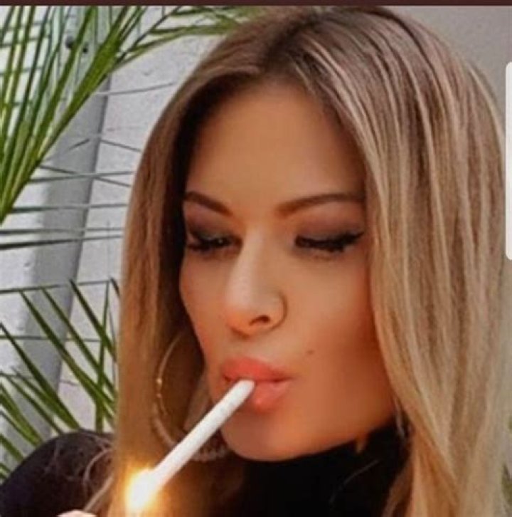 Pin on Women smoking ultra long cigarettes