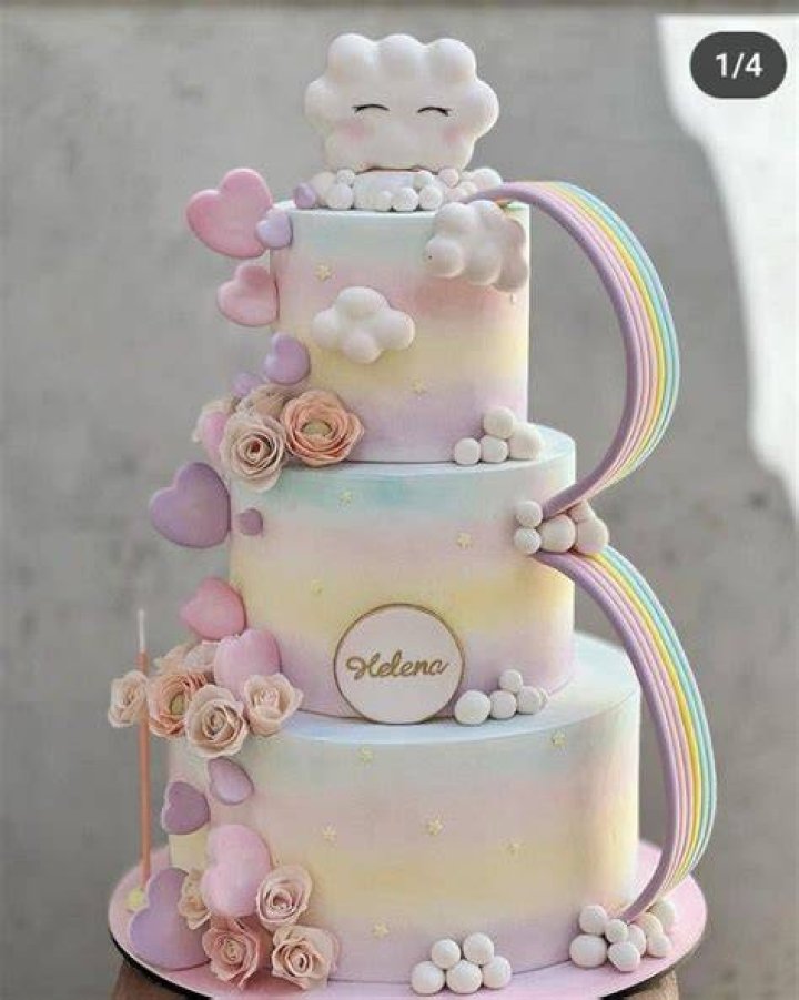 Rainbow and clouds cake Decorated Cake by Angel Cake CakesDecor