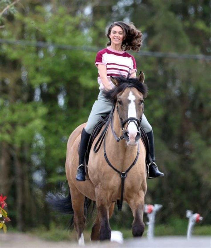 SABRINA BARTLETT Riding a Horse on the Set of The Larkins in London 05