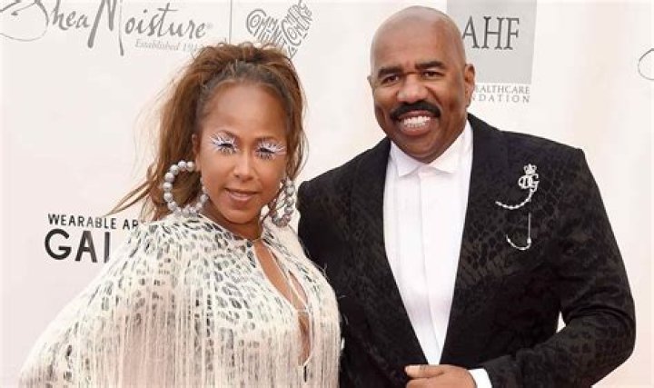 Steve Harvey and wife Marjorie Bridges pose in the press room of the